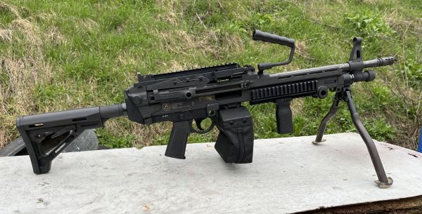 PZD 556 machine gun on the table with grass on the background